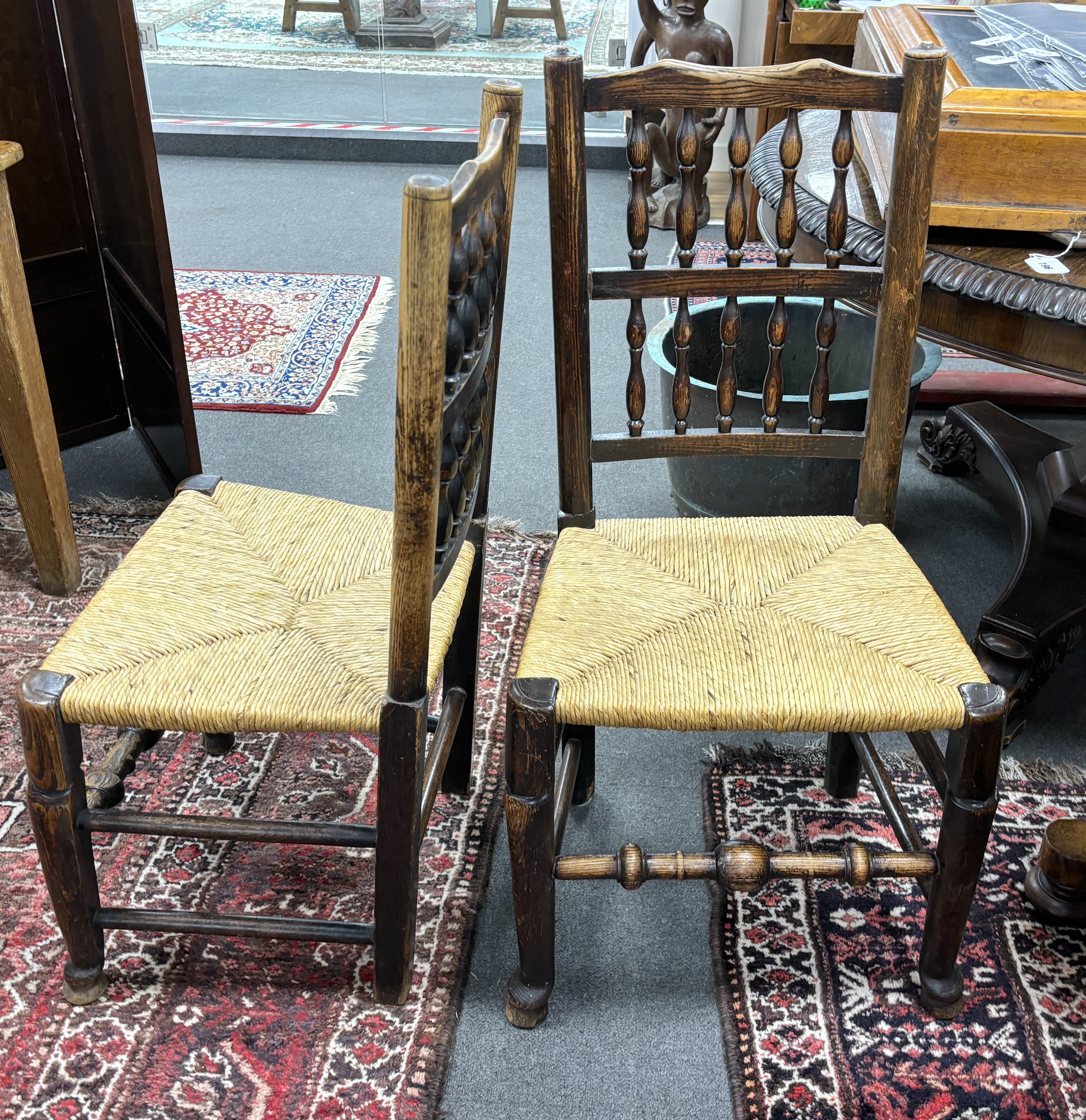 A set of four Lancashire ash and beech rush seat dining chairs. Condition - fair